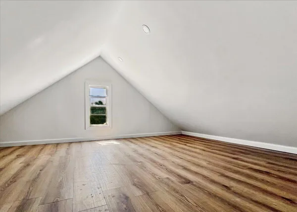 a view of an house with backyard space and garden