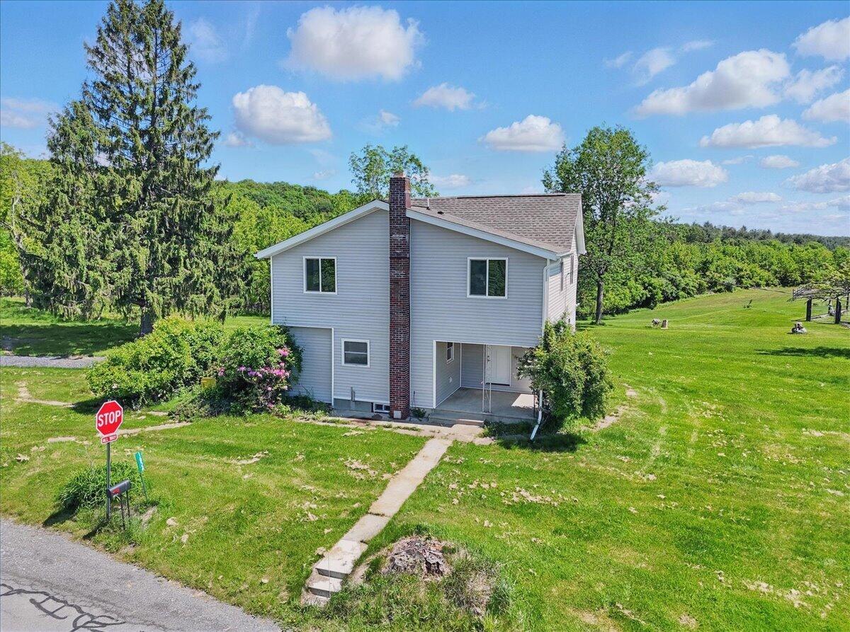 1652 Bonser Road Saylorsburg, PA 18353 - Photo 47 of 62 a view of an house with backyard space and garden