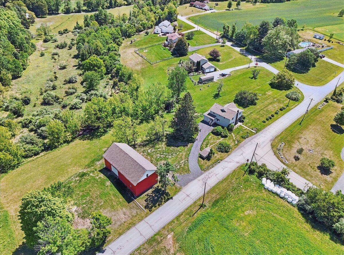 1652 Bonser Road Saylorsburg, PA 18353 - Photo 52 of 62 an aerial view of a house with a garden and lake view