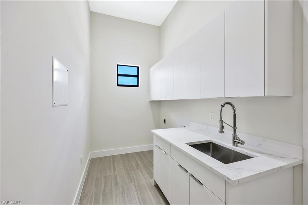 1297 Trail Terrace Drive Naples, FL 34103 - Photo 29 of 29 a view of a kitchen with sink and dishwasher