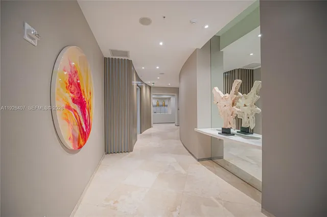 a living room with furniture a flat screen tv and a large window