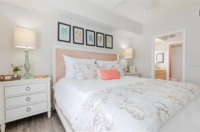 a bedroom with a bed a lamp and a window