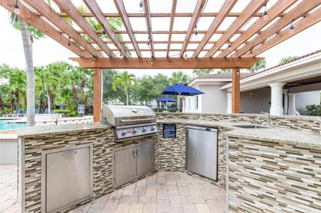 a kitchen with a stove a sink and a refrigerator