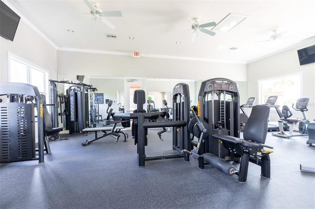 1010 Northwest Fresco Way, Unit 3B05303 Stuart, FL 34994 - Photo 40 of 47 a view of a room with gym equipment