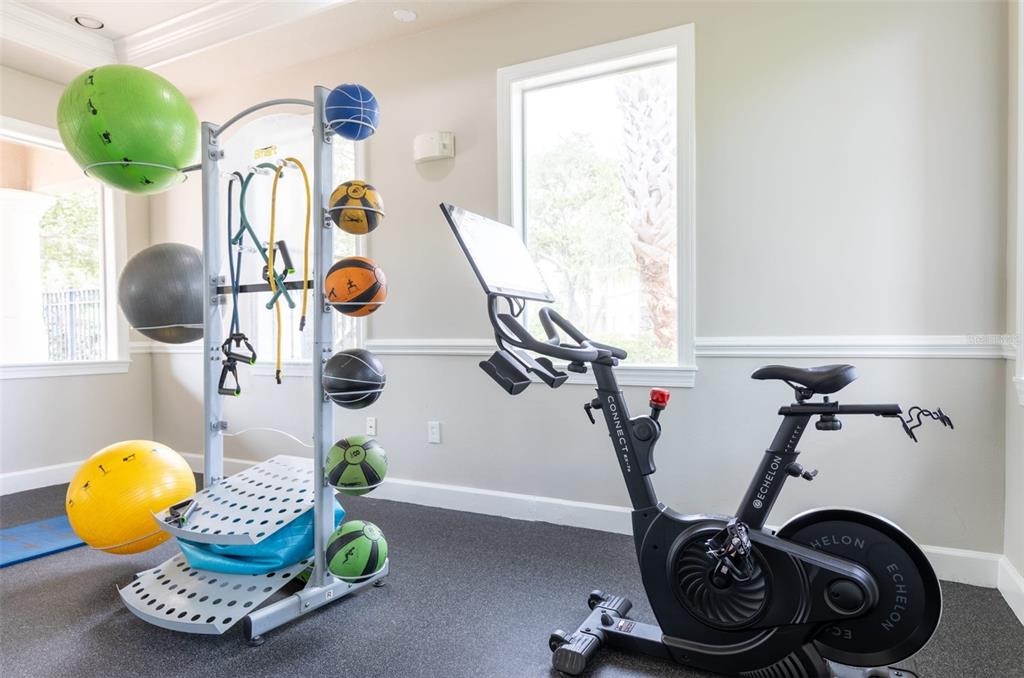 1010 Northwest Fresco Way, Unit 3B05303 Stuart, FL 34994 - Photo 42 of 47 a room with gym equipment