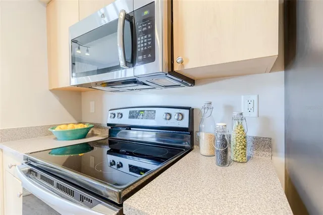 a kitchen view with a stove and a microwave