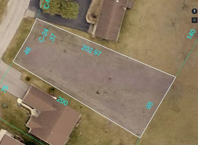 an aerial view of a house with a lake view