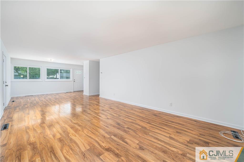 15 Pelham Road Kendall Park, NJ 08824 - Photo 13 of 26 a view of empty room with wooden floor