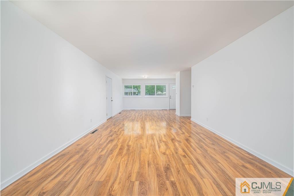 15 Pelham Road Kendall Park, NJ 08824 - Photo 14 of 26 a view of empty room with wooden floor