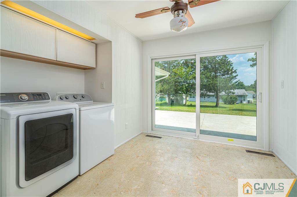 15 Pelham Road Kendall Park, NJ 08824 - Photo 18 of 26 a view of an empty room with a fireplace and a window