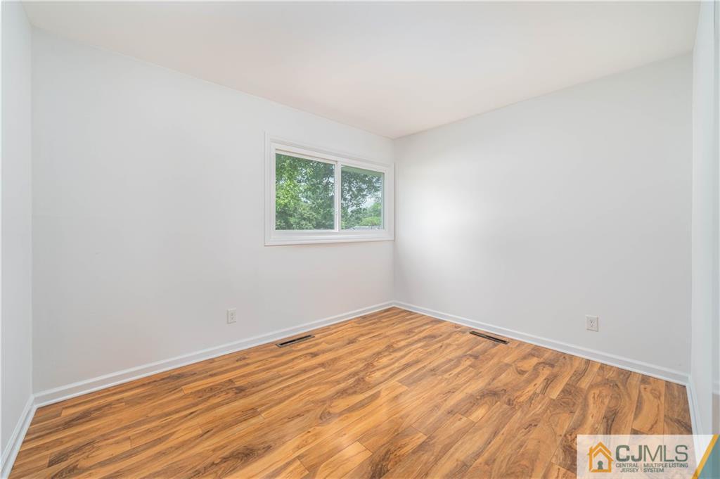15 Pelham Road Kendall Park, NJ 08824 - Photo 22 of 26 an empty room with a window