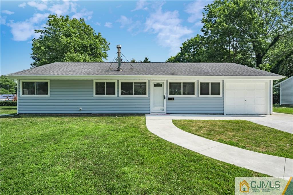 15 Pelham Road Kendall Park, NJ 08824 - Photo 6 of 26 a house with huge green field in front of it