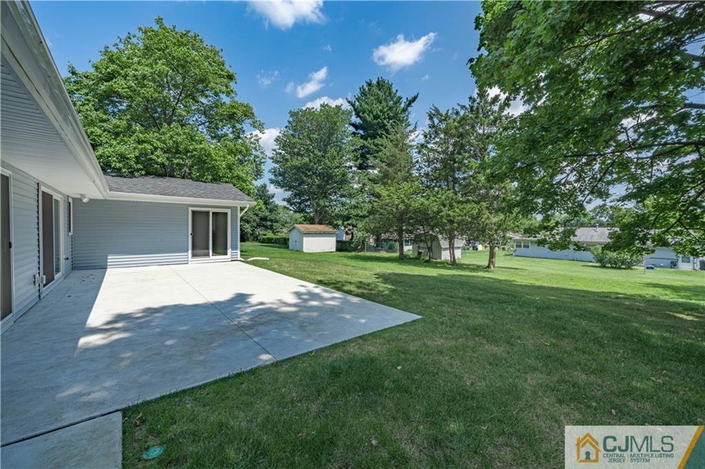 15 Pelham Road Kendall Park, NJ 08824 - Photo 10 of 26 a view of a house with a yard