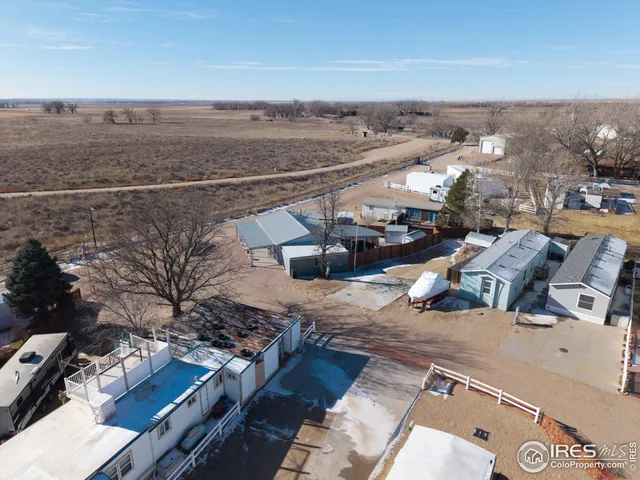 a sign broad on a wall next to a white wall