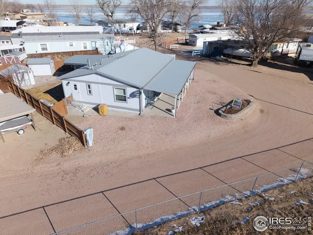 a bedroom with a bed and flat screen tv