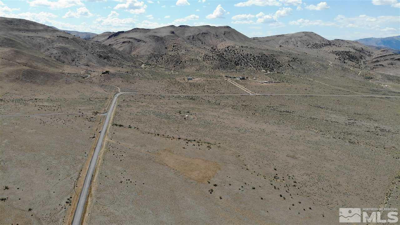305 Ironwood Road Reno, NV 89510 - Photo 11 of 12 a view of a dry field with mountains in the background