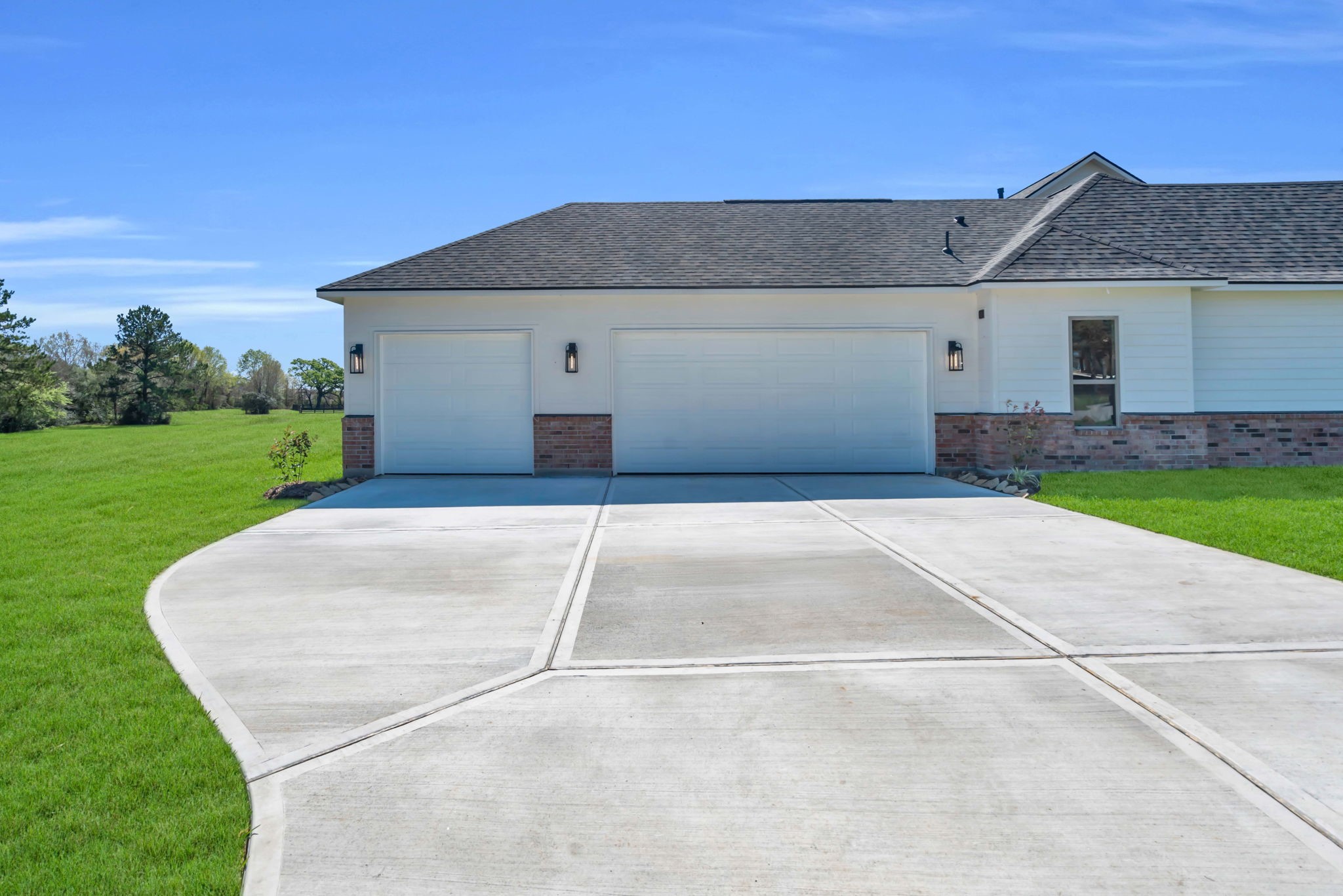 24972 Hopeview Way Montgomery, TX 77356 - Photo 34 of 38 The 3 car garage and driveway enters on the side of the home.