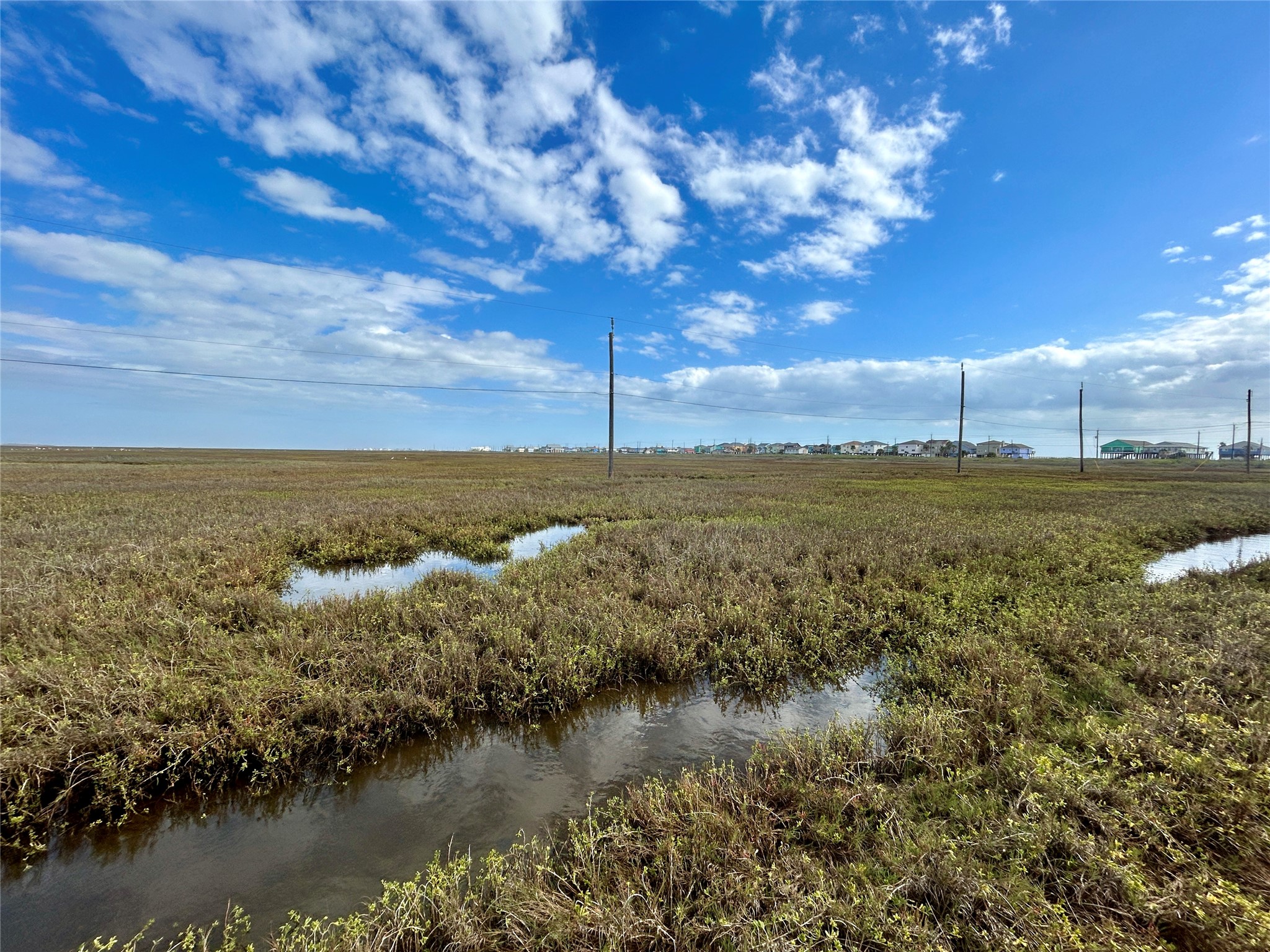 Tbd Seacoast Street Freeport, TX 77541 - Photo 3 of 17 a view of a lake with houses in back
