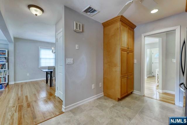 230 Pinelynn Road Glen Rock, NJ 07452 - Photo 7 of 19 a view of a hallway with wooden floor and a bathroom