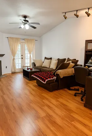 a living room with furniture and a window