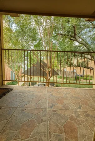 a view of an empty room with a large window