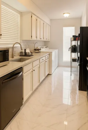 a kitchen with a sink stove and refrigerator