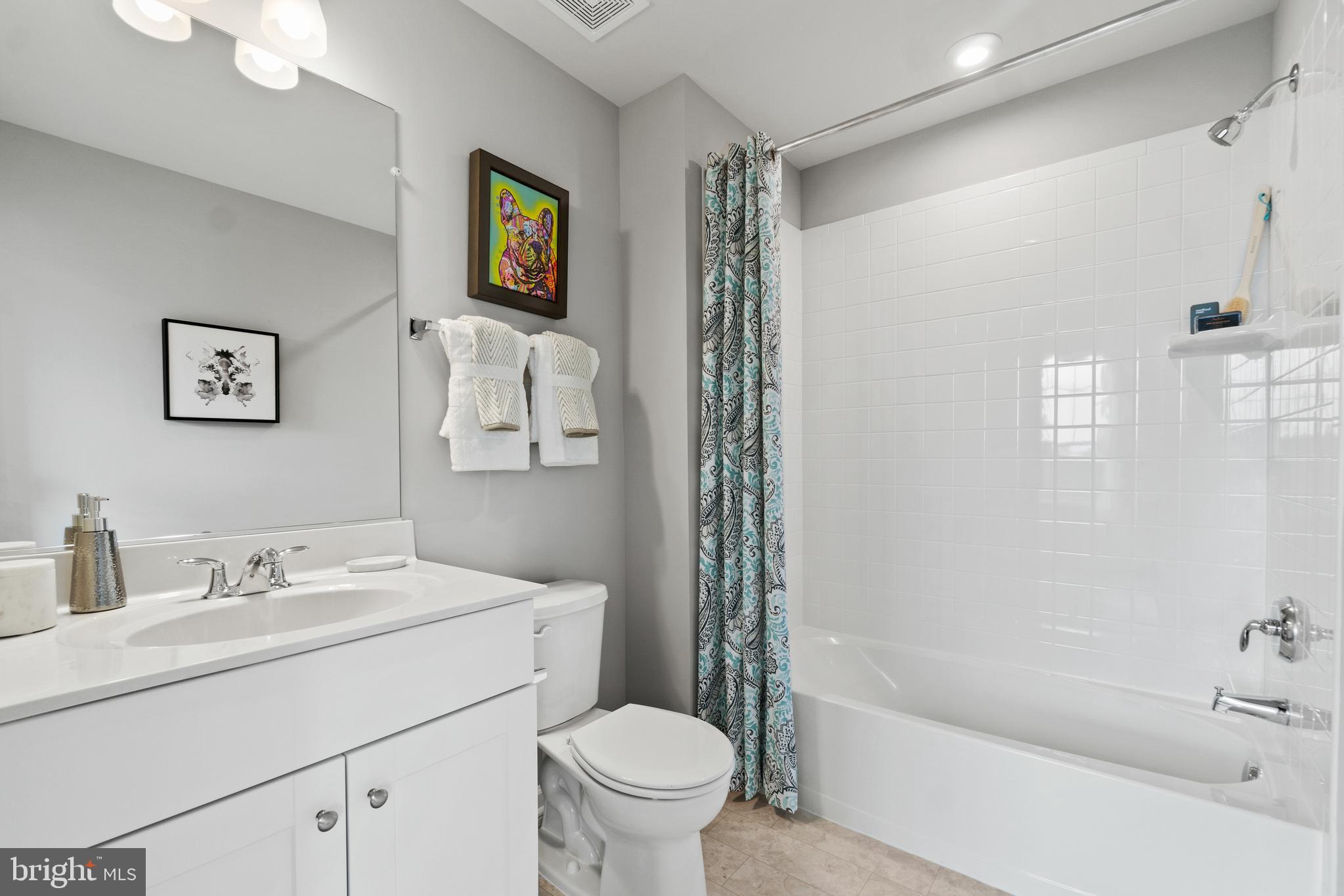300 Presidents Pointe Avenue, Unit 609 Ranson, WV 25438 - Photo 23 of 87 a bathroom with a sink a toilet and a bathtub