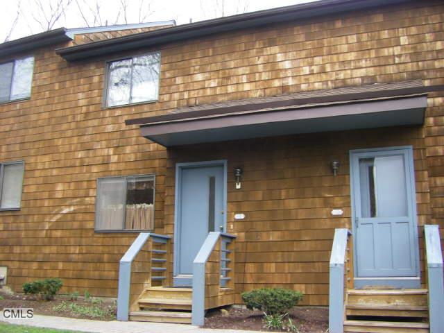 166 Old Brookfield Road, Unit 106 Danbury, CT 06811 - Photo 1 of 1 a front view of a house with a window