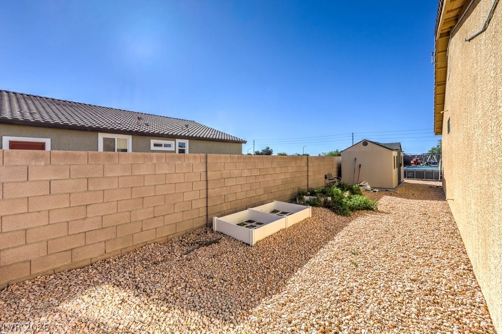 1593 Valley Home Court Logandale, NV 89021 - Photo 44 of 57 Side-yard, garden space.