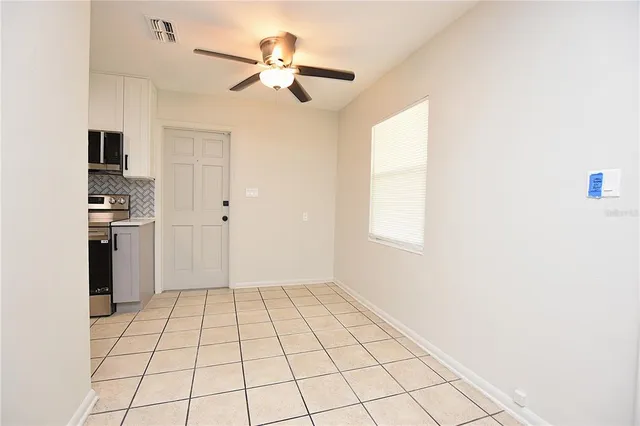 a view of an empty room and closet area