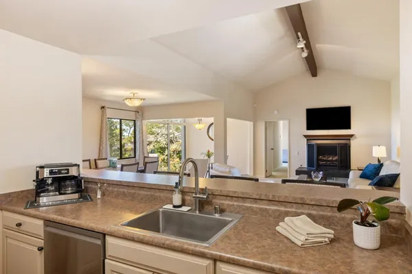 a kitchen with a stove a sink and a cabinets