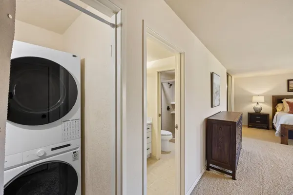 a view of a hallway with washer and dryer