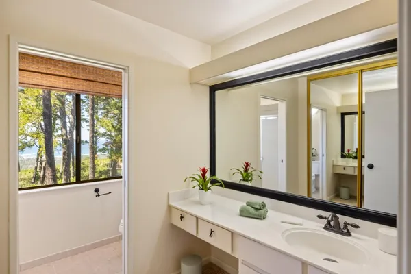 a bathroom with a double vanity sink and mirror