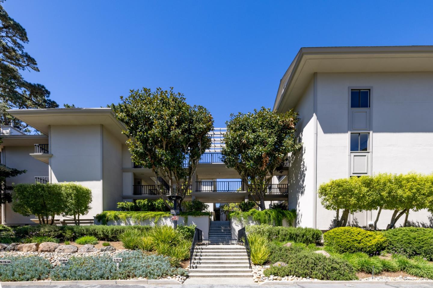 4 Ocean Pines Lane Pebble Beach, CA 93953 - Photo 38 of 49 a front view of house with yard and green space