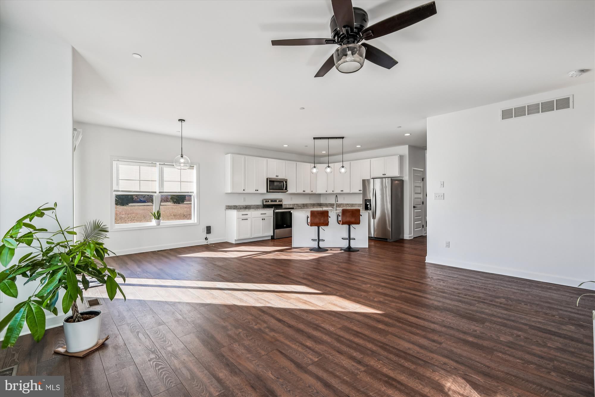 17753 Marvel Road Marydel, MD 21649 - Photo 46 of 65 Dining area and modern kitchen from fireplace