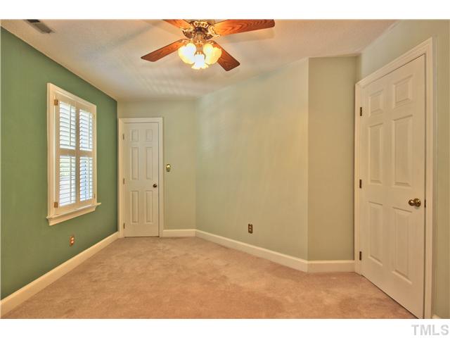 8334 Wycombe Lane Raleigh, NC 27615 - Photo 17 of 25 a view of an empty room with window and a chandelier