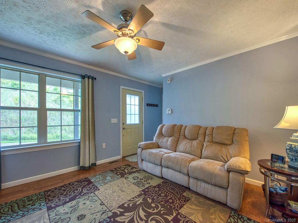 81 Relief Loop Clyde, NC 28721 - Photo 12 of 39 a living room with furniture and a window
