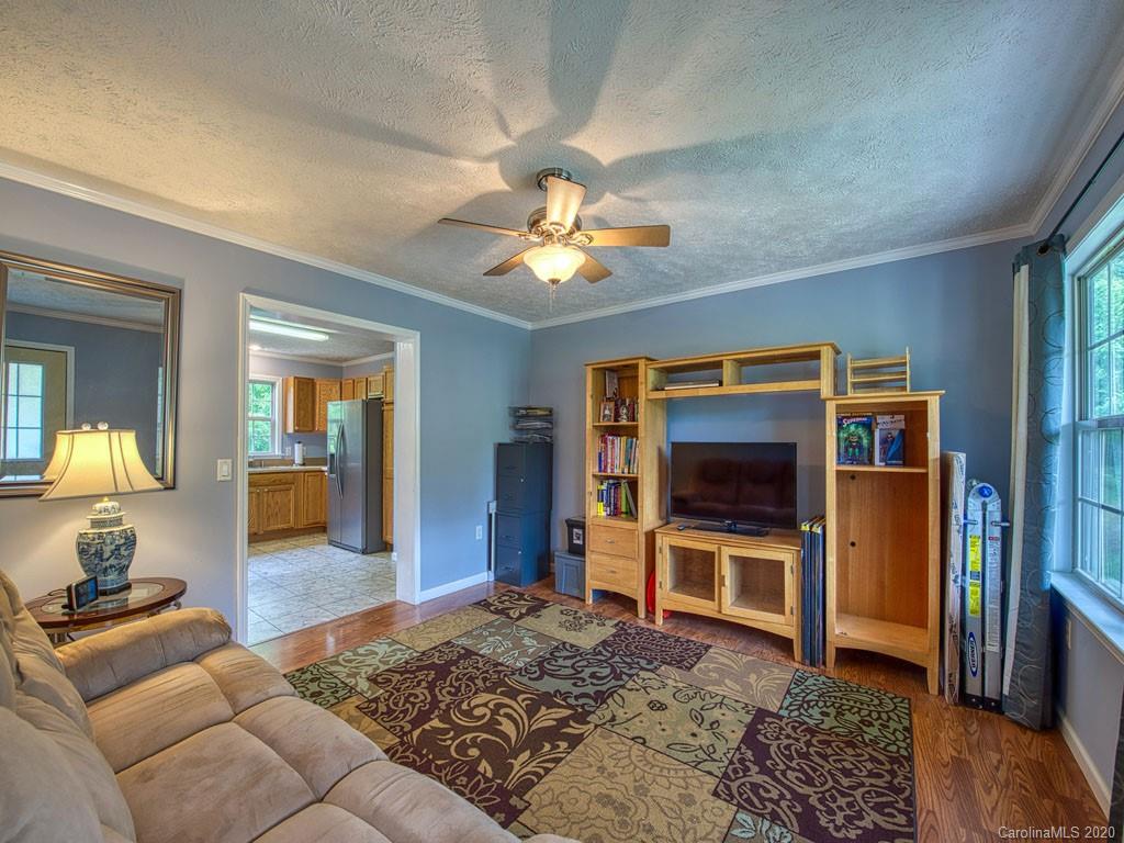81 Relief Loop Clyde, NC 28721 - Photo 13 of 39 a living room with furniture and a flat screen tv