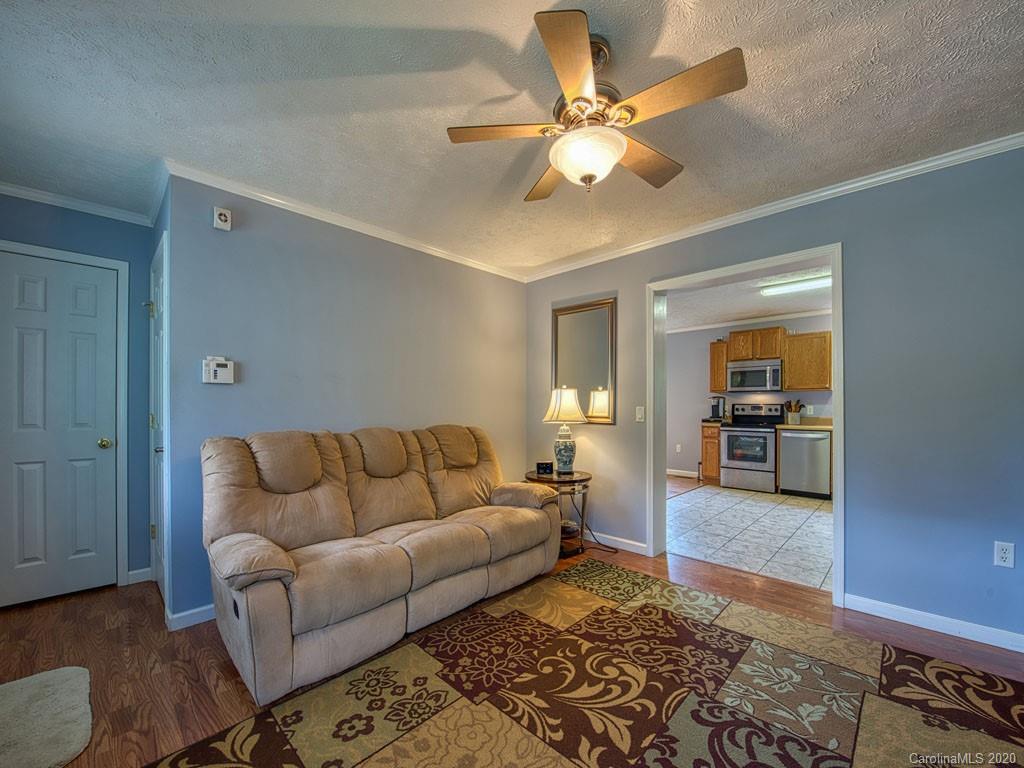 81 Relief Loop Clyde, NC 28721 - Photo 14 of 39 a living room with furniture and a rug