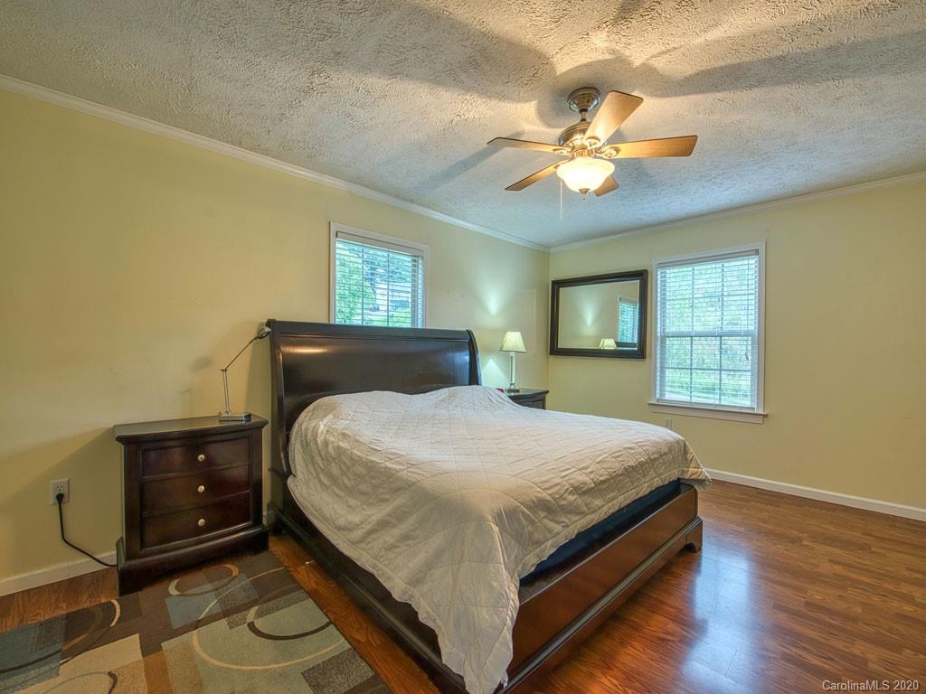 81 Relief Loop Clyde, NC 28721 - Photo 22 of 39 a bedroom with a bed and window