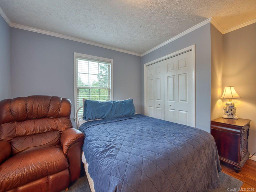 81 Relief Loop Clyde, NC 28721 - Photo 28 of 39 a bedroom with a bed and window