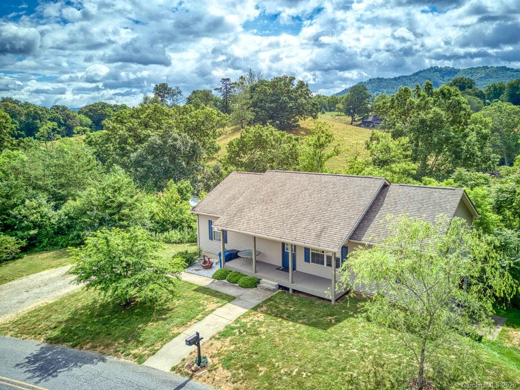 81 Relief Loop Clyde, NC 28721 - Photo 4 of 39 an aerial view of a house with yard and large tree