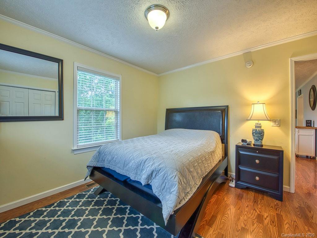 81 Relief Loop Clyde, NC 28721 - Photo 31 of 39 a bedroom with a bed and a window