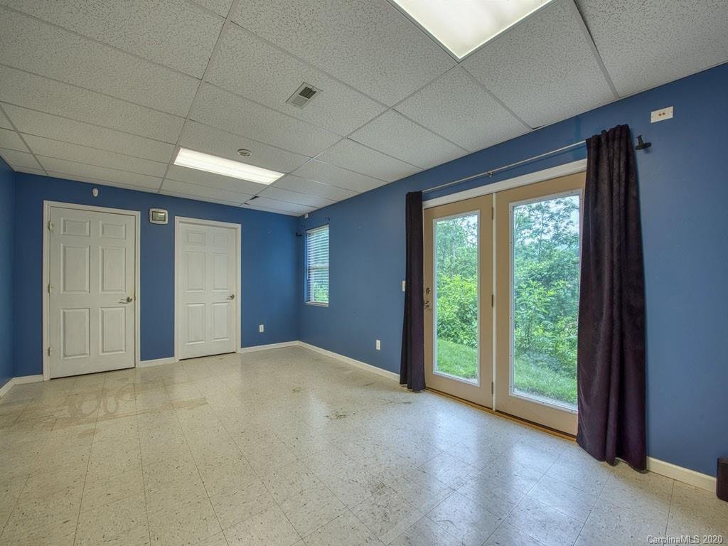 81 Relief Loop Clyde, NC 28721 - Photo 35 of 39 a view of an empty room with wooden floor and next to a window