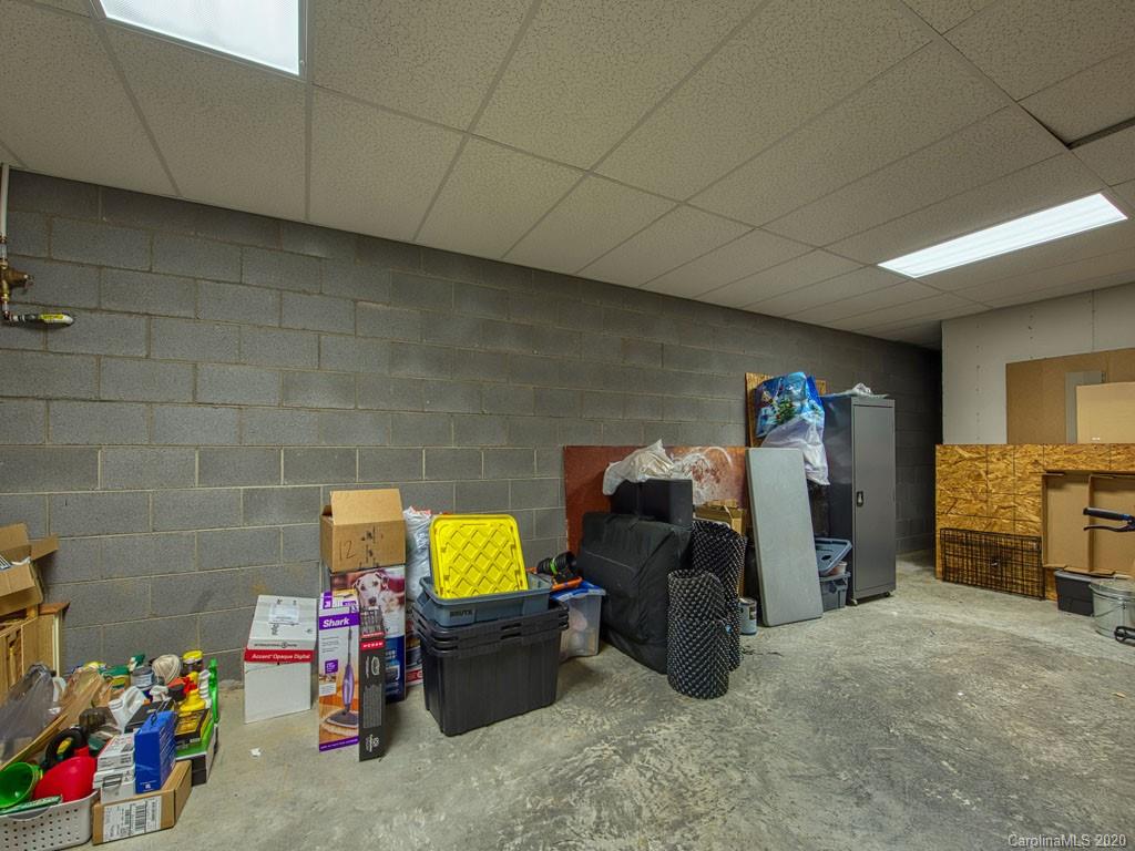 81 Relief Loop Clyde, NC 28721 - Photo 36 of 39 a storage room with furniture and washing machine