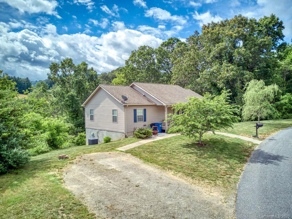 81 Relief Loop Clyde, NC 28721 - Photo 6 of 39 a house with trees in the background