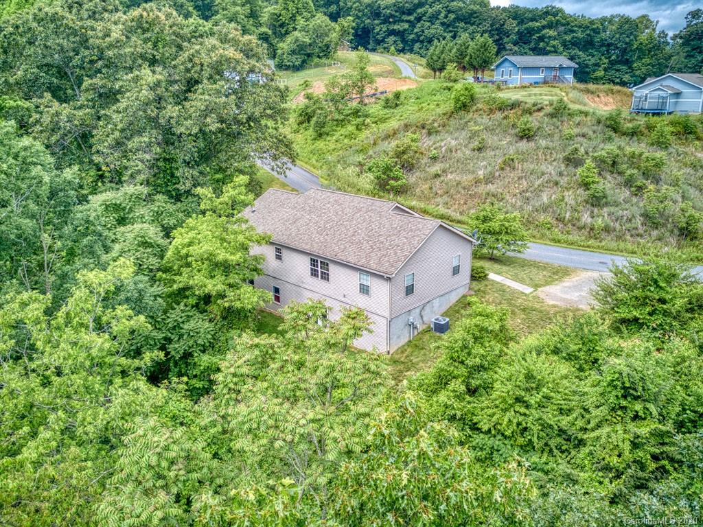 81 Relief Loop Clyde, NC 28721 - Photo 10 of 39 an aerial view of a house with a yard