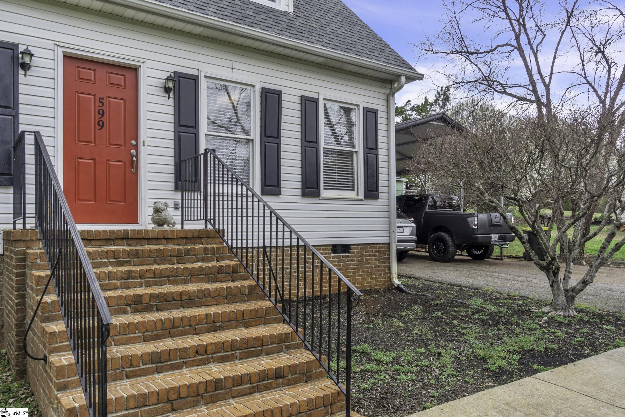599 Sheriff Mill Road Easley, SC 29642 - Photo 3 of 29 Brick steps and railing lead to the front welcoming entrance.