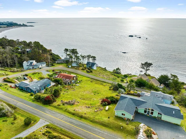 an aerial view of a house with a swimming pool