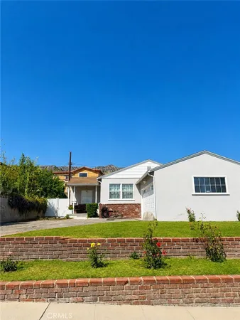 a view of a big building with a big yard